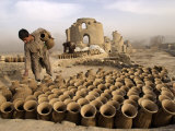 Boy, Left, Helps His Father Mohammed