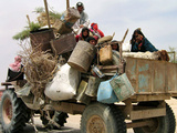 An Iraqi Family and Their Sheep Ride on Their Tractor to Fetch Water Outside the Town of Najaf