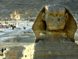 Tourists Stroll by Sphinx at the Historical Site of the Giza Pyramids, Near Cairo, Egypt