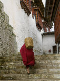 Monk Carrying Basket in Trongsa Dzong, Bhutan