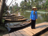 Woman Near Old Boats, Mekong Delta, Vietnam