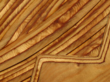 Close-up of Smooth Detail Lines Carved into a Piece of Wood