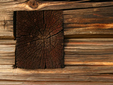 An Old and Weathered Wall with Wooden Slats and a Wood Beam