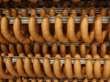 Many Sausages Hanging from Racks