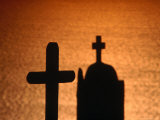 Cross and Church Silhouetted at Sunset, Greece