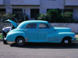 Man Looking in Boot of a Blue 1948 Chevrolet, Vedado, Cuba