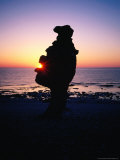 Buy Raukar Limestone Formations, Silhouetted Against a Perfect Sunset at Langhammarshammaren, Sweden at AllPosters.com