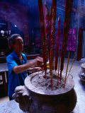 Buy Man Making Incense Offerings in Temple, Vietnam at AllPosters.com
