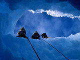 Buy Three Explorers Looking Through Hole in Ice, Antarctica at AllPosters.com