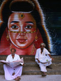 Buy Local Men Read Newspapers in Front of Painted Shutter, Kozhikode, Kerala, India at AllPosters.com