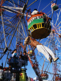 Operator Performing Dare-Devil Acts on Ferris Wheel at Camel Fair, Pushkar, Rajasthan, India