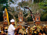 Buy A Pemangku (Spiritual Leader) Sprinkles Holy Water at Pura Penataran Agung, Indonesia at AllPosters.com