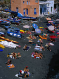 People on Black Volcanic Sand Beach, Rinella, Sicily, Italy