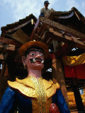 Buddhist Monastery Statue and Worker at Xishuangbanna, Yunnan, China
