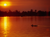 Buy Fisherman Heading Out for Night Fishing Under Mekong River Sunset, Si Phan Don, Laos at AllPosters.com