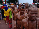 Buy Men Dressed in Mud, Mandarin Orange Necklaces and Bamboo Staffs at Phi Ta Khon Festival, Thailand at AllPosters.com