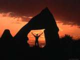 Person Standing in Rock Cut at Sunset, Cappadocia, Turkey