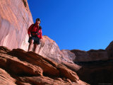 Buy Hiker Standing on a Ledge at Lake Powell, Utah, USA at AllPosters.com