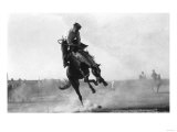 Cowboy riding Bronco in Burns, OR Rodeo Photograph - Burns, OR