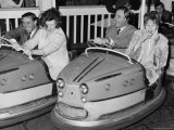 Racing Drivers Graham Hill and Jim Clark Enjoying a Dodgem Ride
