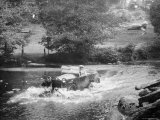 Buy 1925 Lancia Lambda Driving Through a Shallow River at AllPosters.com