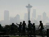 Buy Members of the Cascade Bike Club Pause and Take in a Foggy View of the Space Needle at AllPosters.com
