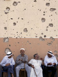 Lebanese Residents Rest in Front of a Wall