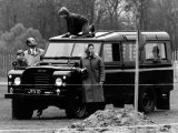 Queen Elizabeth II Looks on as Prince Edward Plays on the Roof of Their Land Rover