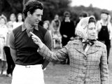 Queen Elizabeth II Shows Prince Charles Sign at a Polo Match at Windsor Great Park Points Finger