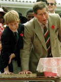 Buy Prince Charles with Son Prince Harry Leaving Hand Prints in Concrete During Tour in South Africa at AllPosters.com