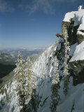 Buy Man Rappels Down Red Mountain with a Snowboard on His Back at AllPosters.com