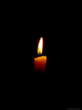 Candle Light Emerging From the Darkness