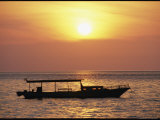 Buy An Anchored Boat Silhouetted at Sunset at AllPosters.com