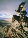Hunter on Horseback Atop a Hill Holding a Golden Eagle in Mongolia