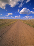 Cumulus Clouds Above a Dirt Road on a Wyoming Prairie Photographic Print