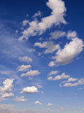 Cumulus Clouds Above the Masai Mara National Reserve Photographic Print