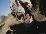 Buy Close View of a San Bushman Holding a Slingshot at AllPosters.com