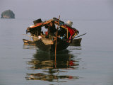 Buy Moken Tribesman Poles His Kabang Through Still Water Pulling a Canoe at AllPosters.com