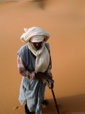 Buy Overhead of Man in Local, Traditional Costume, Walking in Desert at AllPosters.com