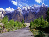 Road of the Karakoram Highway Leading Towards Cloud-Swathed Mountains