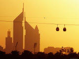 Creekside Park Cable Cars Passing the Emirates Towers at Sunset