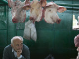 Butcher and Pig Heads in the Old Market
