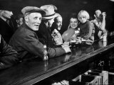 Dam Workers with Family Members Enjoying Beer at Local Bar