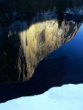 Buy The largest granite rock on Earth reflects in the Merced River at AllPosters.com