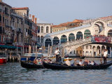 Gondolas along Grand Canal by Rialto Bridge, Venice, Italy