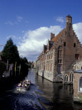 Hans Memling Museum and Canal Boat on the River Dijver, Bruges, Belgium