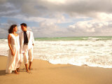 Hispanic Couple Walking Together on the Beach