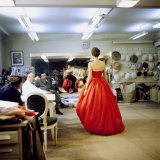 Fashion Designer Christian Dior Commenting on Red Gown for His New Collection Prior to Showing