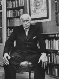 Buy Swiss Psychiatrist Dr. Carl Jung Holding Pipe as He Sits on Chair in His Library at Home at AllPosters.com