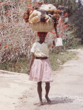 Haitian Woman Carrying Large Basket with Her Market Shopping on Her Head
